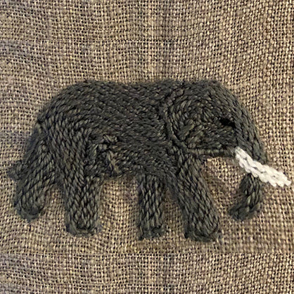 Hand embroidered elephant  on linen serviette