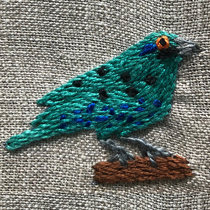 South African bird embroidered onto linen serviette