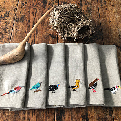 Set of six hand-embroidered table napkins with African indigenous birds on