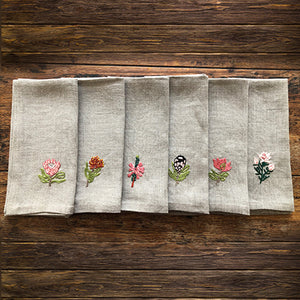 The South African flora and fynbos botanicals range of hand-embroidered serviettes from Ellbe Coetsee