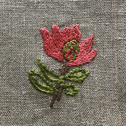 Fynbos embroidered on a linen serviette