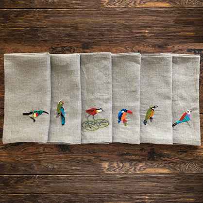 Hand-embroidered set of African birds on linen serviettes