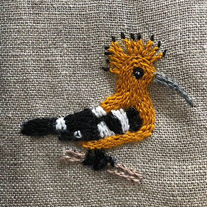 A hoopoe from South Africa on a set of hand embroidered serviettes