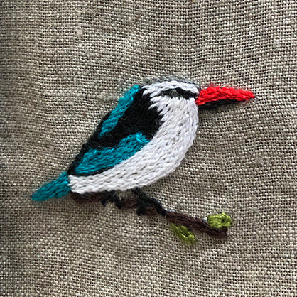 Woodland kingfisher hand embroidered onto table linen