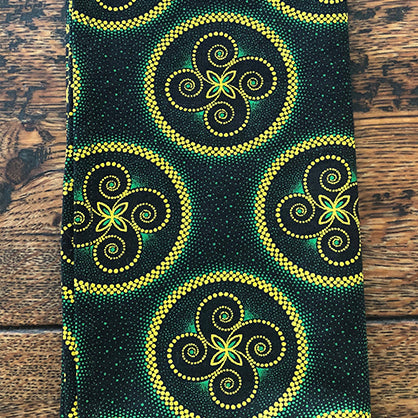 Close up of green and yellow Shwe Shwe fabric used to make African-themed serviettes