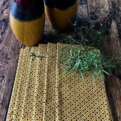 Yellow patterned Shwe Shwe fabric serviettes by Elbe Coetsee